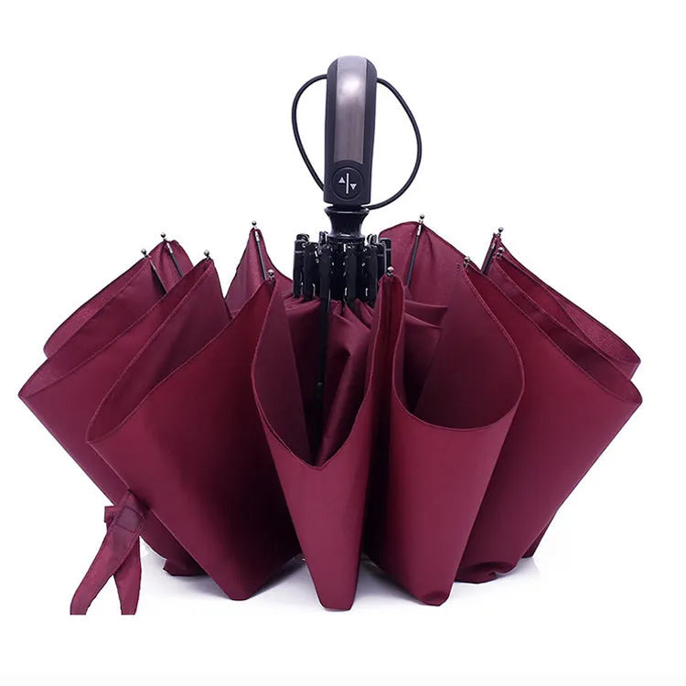 Black automatic triple-folding advertising umbrella with a rubber handle, shown open.