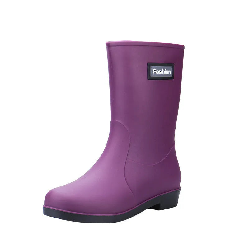 Women's black mid-calf rain boot made of PVC with a low heel.