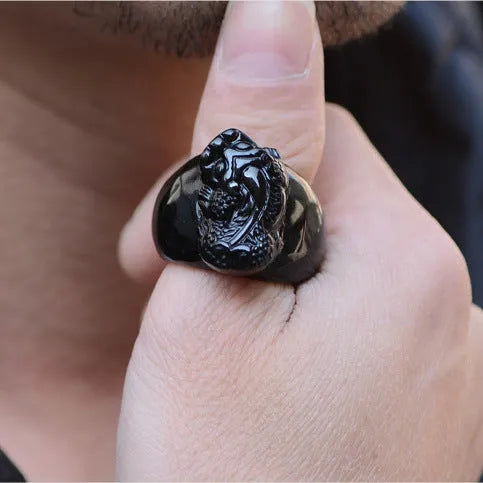 Men's gold sheen obsidian Pixiu thumb ring on an alloy band, shown in domineering style.
