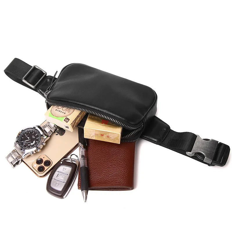 Men's small black leather crossbody bag showing compact size and crossbody strap.