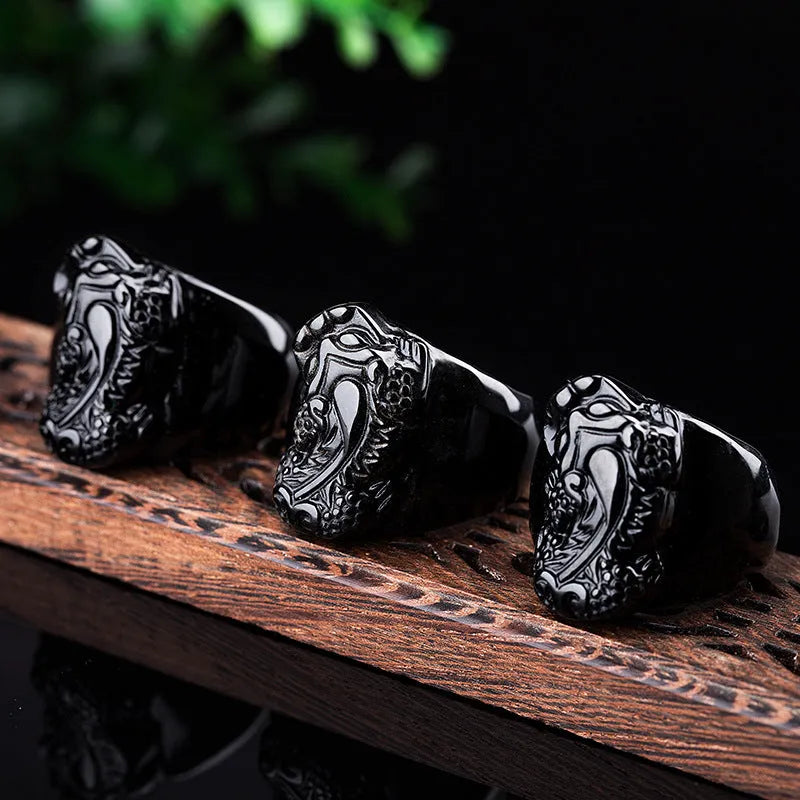 Men's gold sheen obsidian Pixiu thumb ring on an alloy band, shown in domineering style.