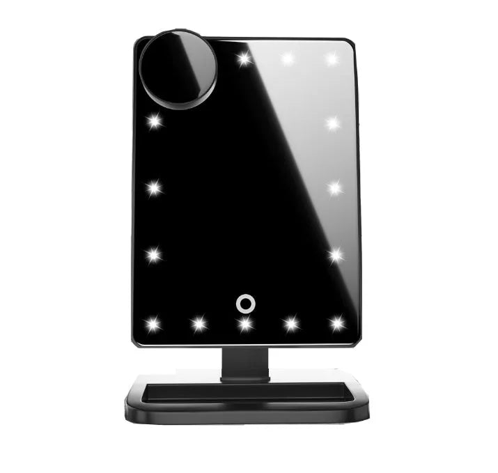 Pink and white LED makeup mirror with circular lights and Bluetooth speaker on a vanity table.