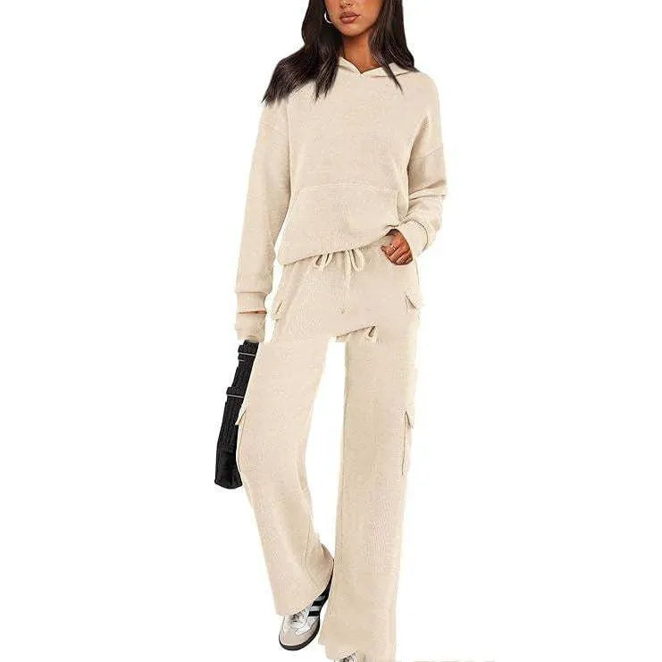 Women's black polyester casual sport suit with long sleeves and full-length trousers laid flat.