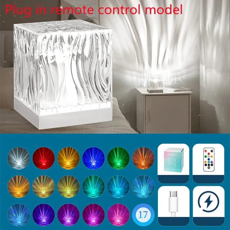 USB-powered crystal table lamp projecting blue water ripple light patterns on a wall