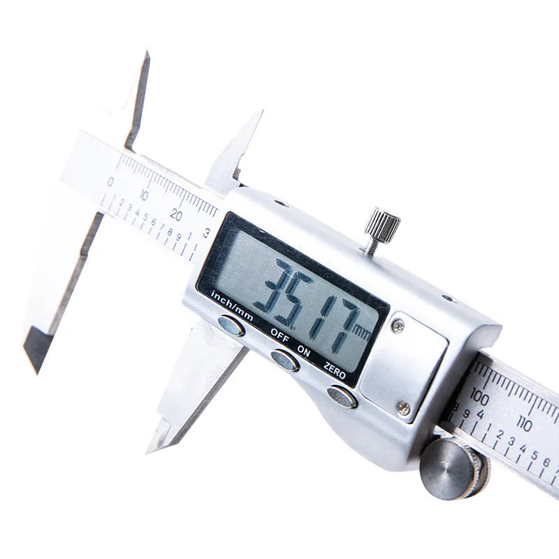 Deli stainless steel digital vernier caliper on a workshop bench showing 0.01mm resolution display.