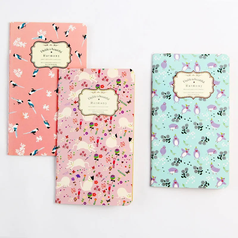 Kraft paper notebook with tassel bookmark showing hand-stitched binding and blank interior pages