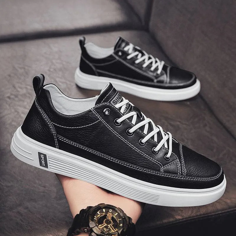 Men's casual white PU leather shoes with round toe and low flat heel on a beige background.