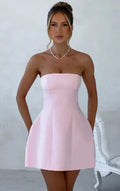 Women's backless tube dress with A-line skirt in solid colour options including black, white, red, and pink