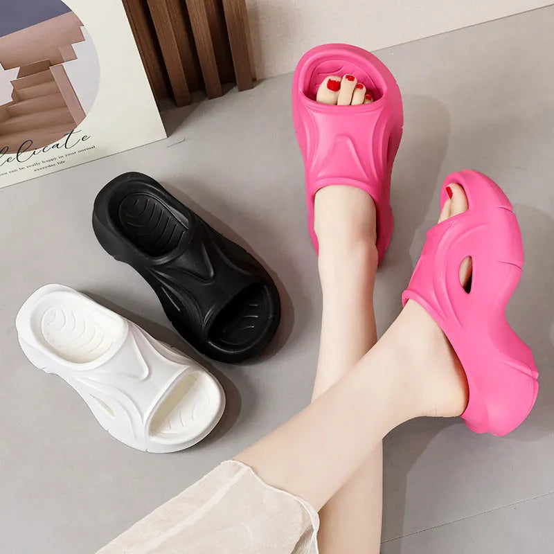 Women's thick-soled EVA foam slippers in white, black, and rose red colours with round toe design