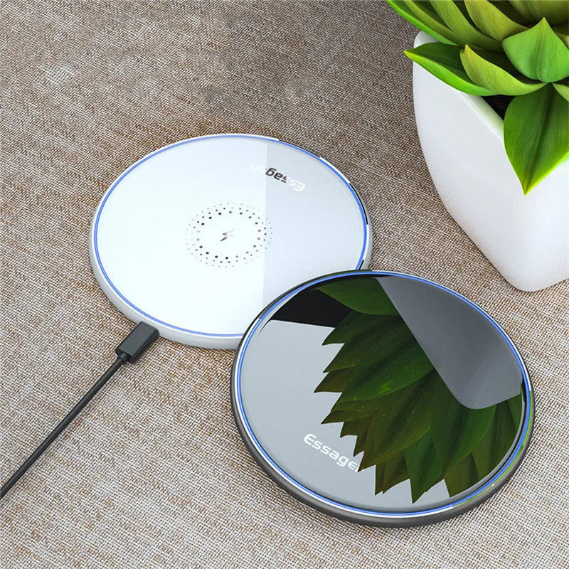 Black aluminium wireless charging pad with LED light and phone positioned for Qi charging