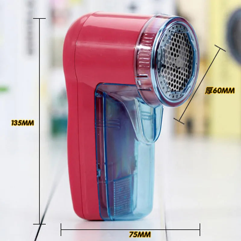 Portable electric clothes lint remover and pill shaver unit with compact white body.