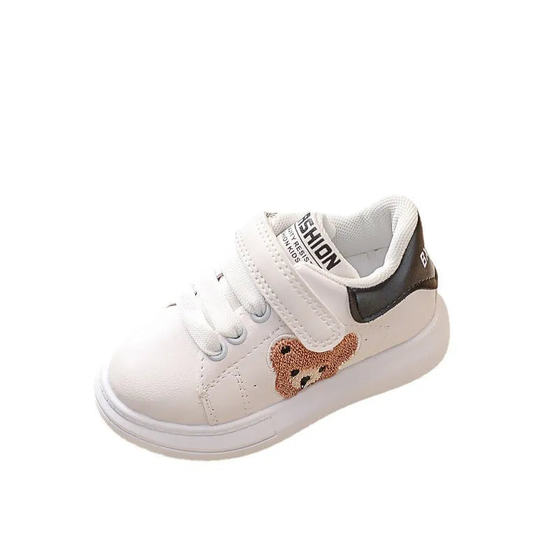 Children's black casual sports shoes with a cartoon bear design on the side, featuring an artificial leather upper and rubber sole.