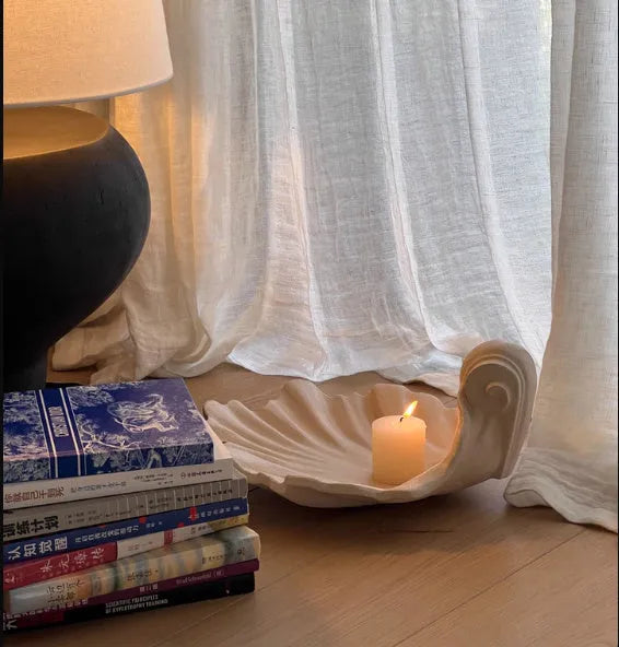 White resin fruit plate decoration with simulation shell design on table