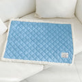 Blue quilted pet blanket for cats showing terry texture and 80x60cm large size dimensions