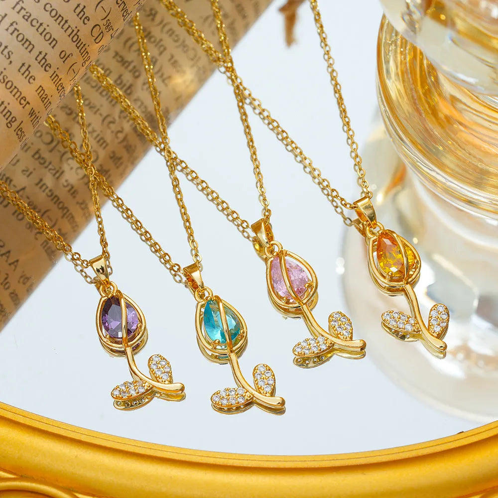 Gold-toned titanium steel necklace with a zircon tulip flower pendant on an adjustable O-ring chain.