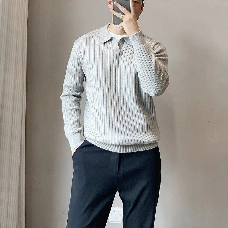 Men's loose grey knitted pullover sweater with a lapel collar on a hanger.