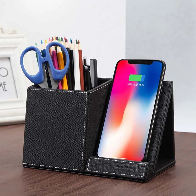 Black leather wireless charging station with pen holder compartment and phone charging surface