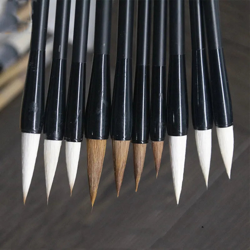 Traditional Chinese student writing brush with Jianhao nib on steel pipe barrel measuring 23cm length