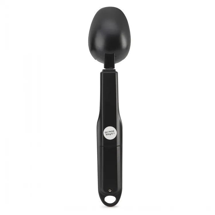 Digital smart measuring spoon with LCD screen showing weight, placed next to mixing bowl.