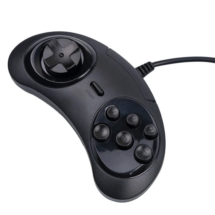 Black Sega USB wired PC game controller with 1.8-metre cable next to a computer.