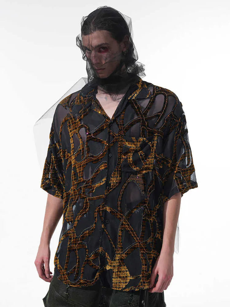 Man's black and grey short-sleeved shirt with translucent snake pattern, loose fit with lapel collar.