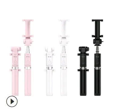 Aluminium alloy Bluetooth selfie stick with remote control and adjustable phone clip next to a smartphone