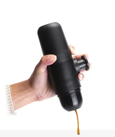 Black portable manual coffee machine measuring 6cm by 17.5cm with stainless steel components