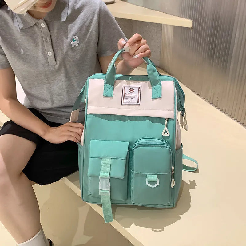 Multi-functional large capacity nylon backpack for high school, breathable with curved shoulder strap and six colour options including black and pink