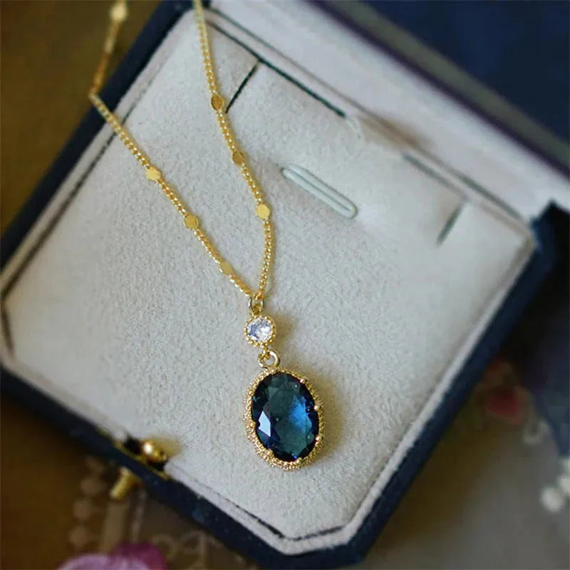 Gold geometric pendant necklace on a model, showcasing French retro design.