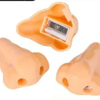 Flesh-coloured geometric pencil sharpener with a big hole for large pencils on a white background.