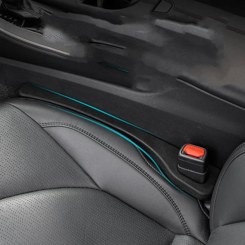 Car seat gap sealing strip in polyresin with integrated handle in four colour options
