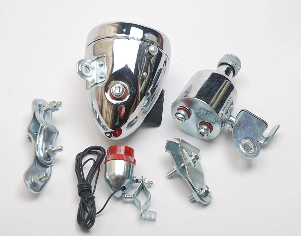 Silver bicycle dynamo-powered generator light kit mounted on a bicycle frame for front and rear lighting.