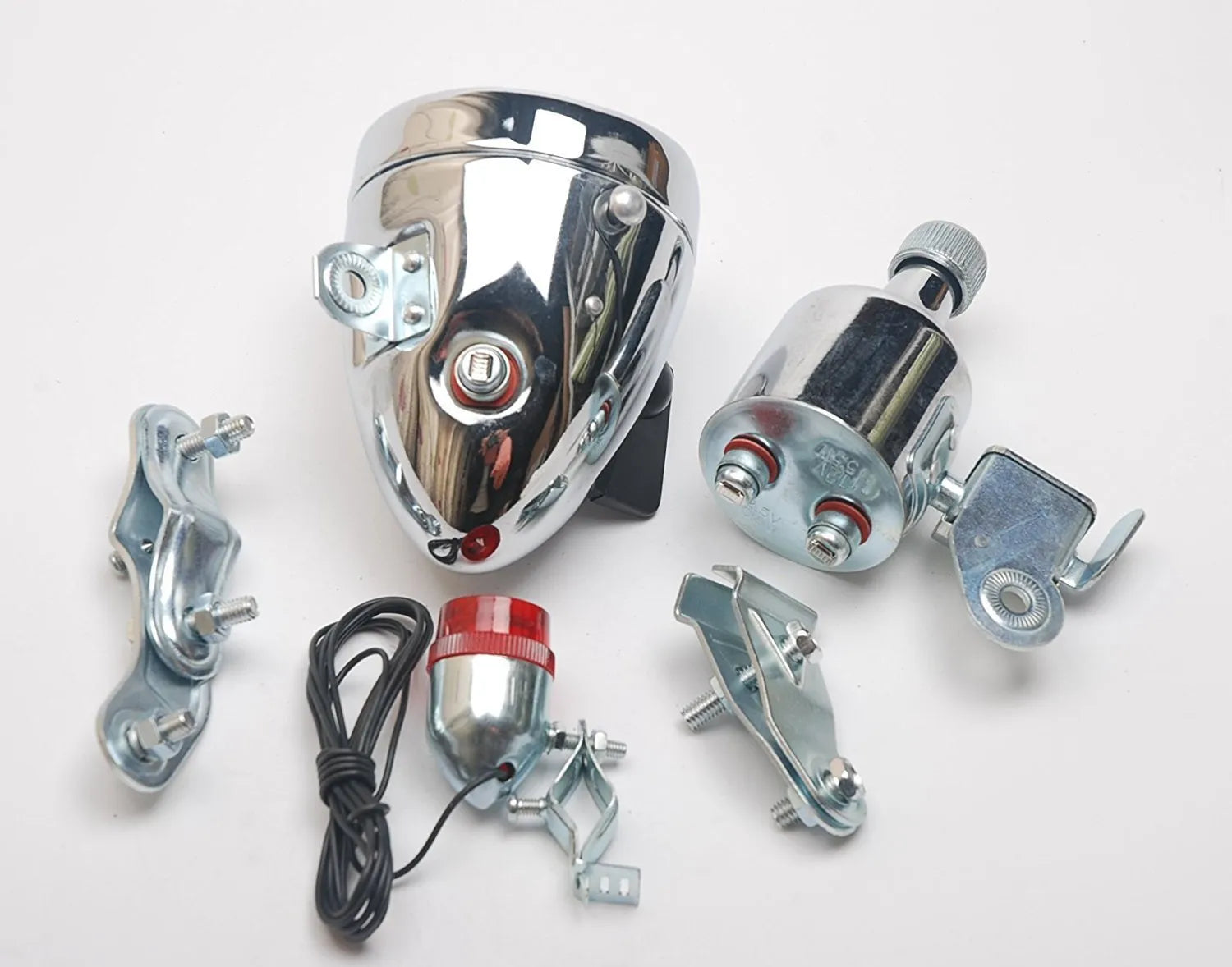 Silver bicycle dynamo-powered generator light kit mounted on a bicycle frame for front and rear lighting.