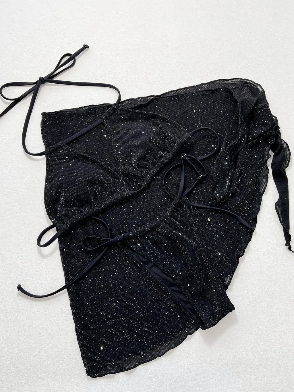 Black three piece bikini swimsuit set with a top and shorts on a mannequin.