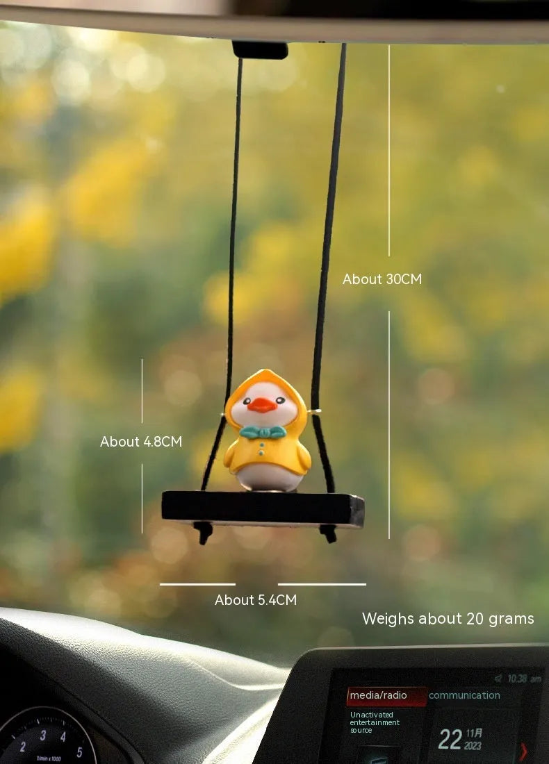 Yellow plastic duck doll car hanging ornament shown in four design variations.