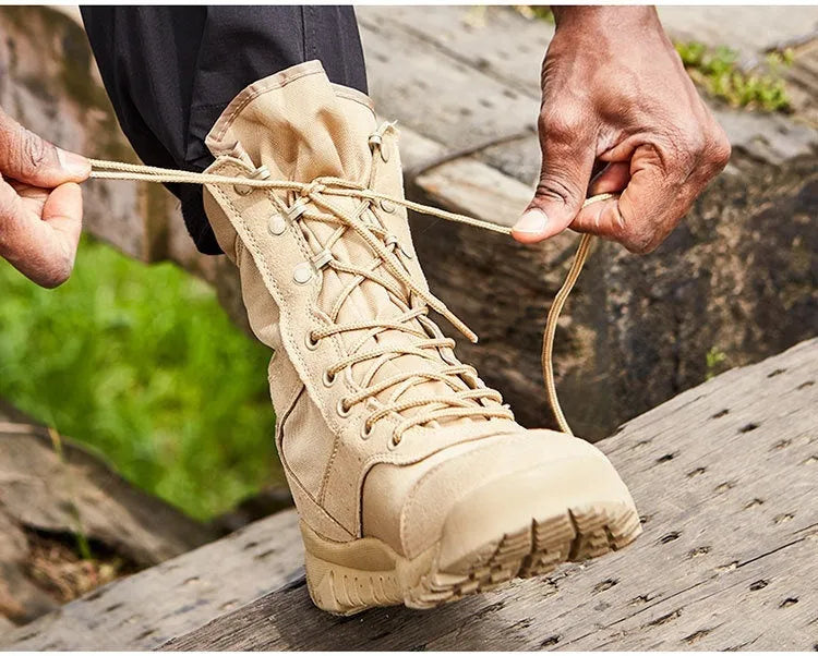 Yulong summer tactical desert combat boots in black or sand colour on an outdoor rocky terrain.