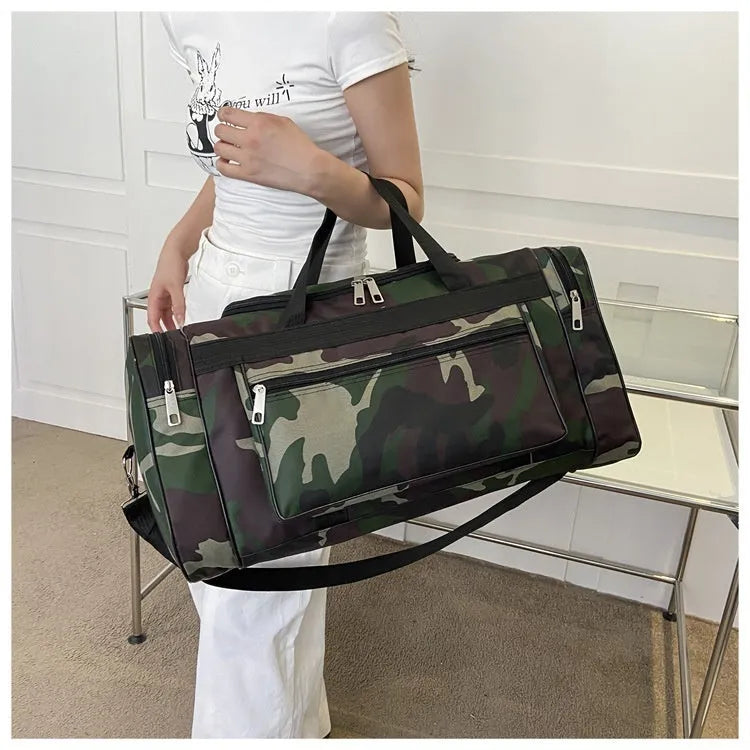 Large camouflage-coloured luggage bag made from waterproof fabric with striped lining.