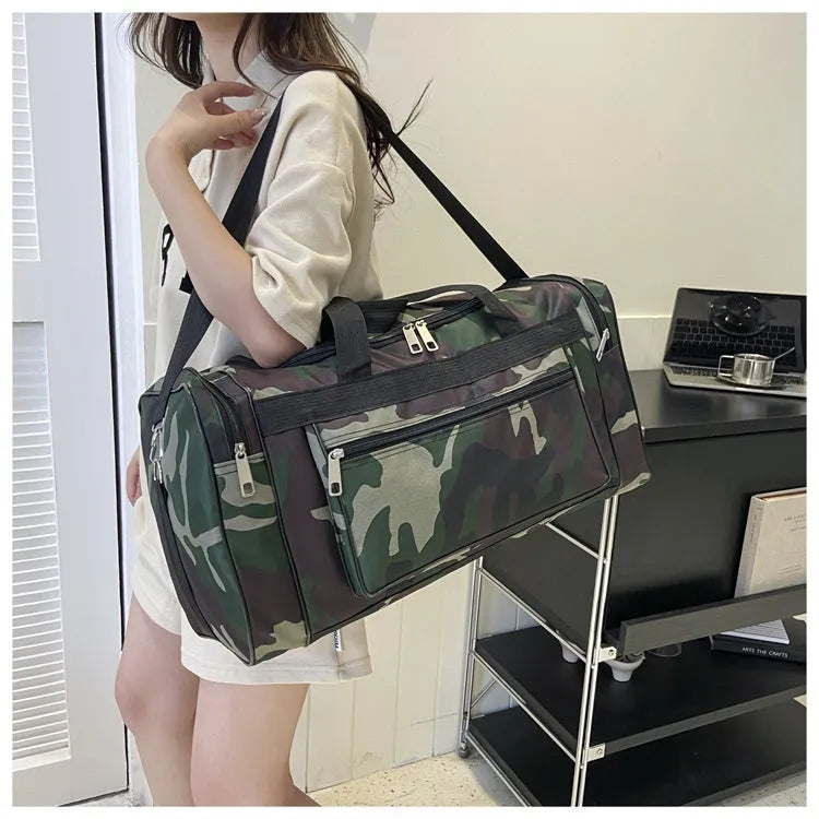 Large camouflage-coloured luggage bag made from waterproof fabric with striped lining.