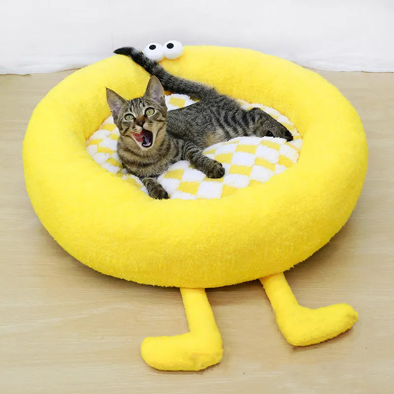 A plush, thick nest-style dog bed for small to medium sized pets, shown in yellow, pink, or black.
