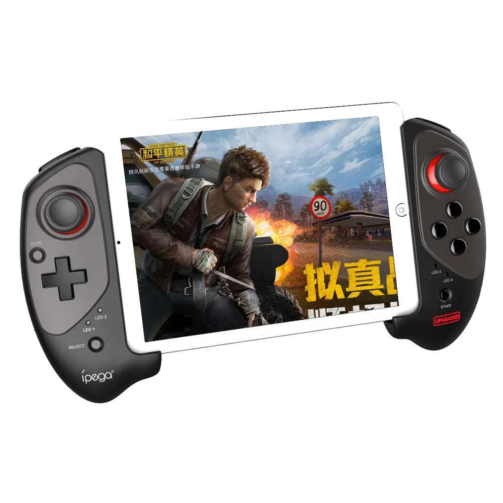 Red telescopic gamepad controller with USB cable on a dark surface.