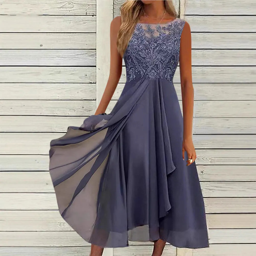 Women's sleeveless green chiffon dress with lace hollow-out detailing on a mannequin.