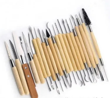 27-piece pottery clay tool set with stainless steel, wood, and plastic sculpting tools rolled in a package.