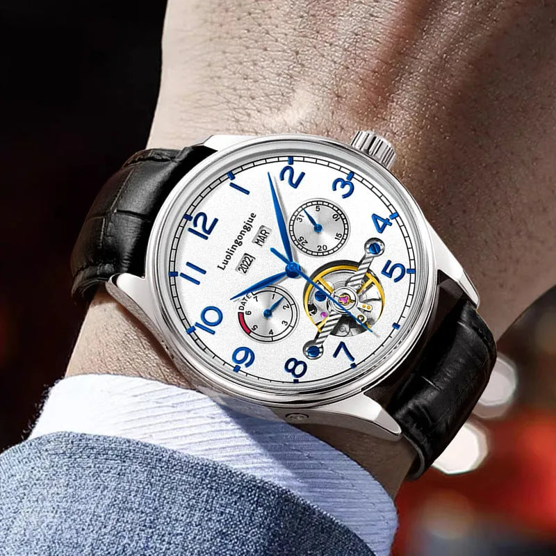 Men's stainless steel mechanical watch with hollow dial and leather strap.