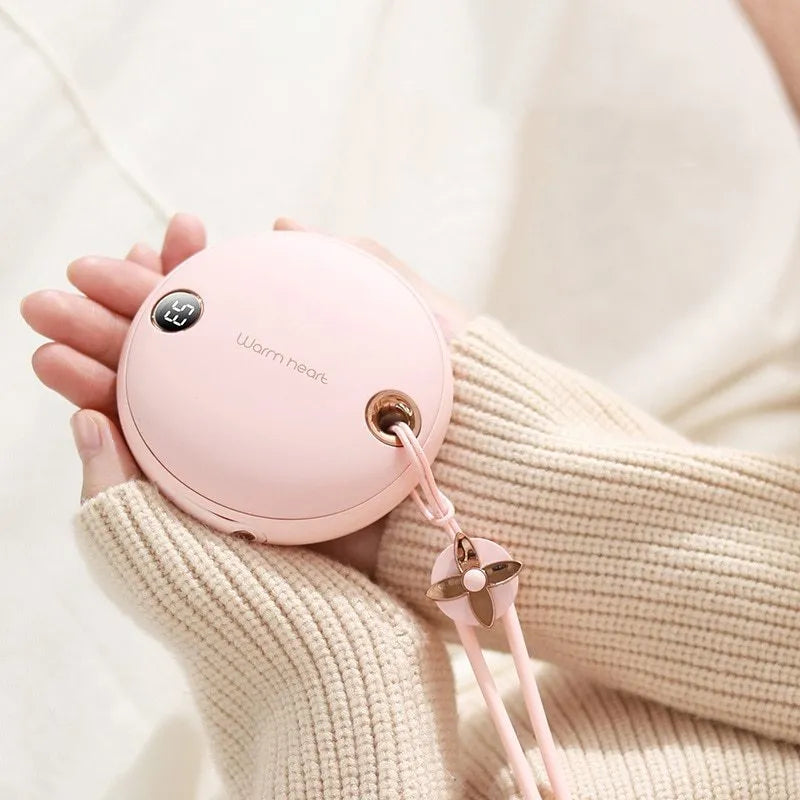 Green portable hand warmer power bank with digital display showing battery level, includes Type-C cable