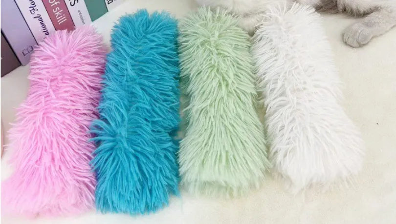 Soft blue plush cat toy pillow measuring 27 by 10 centimetres.