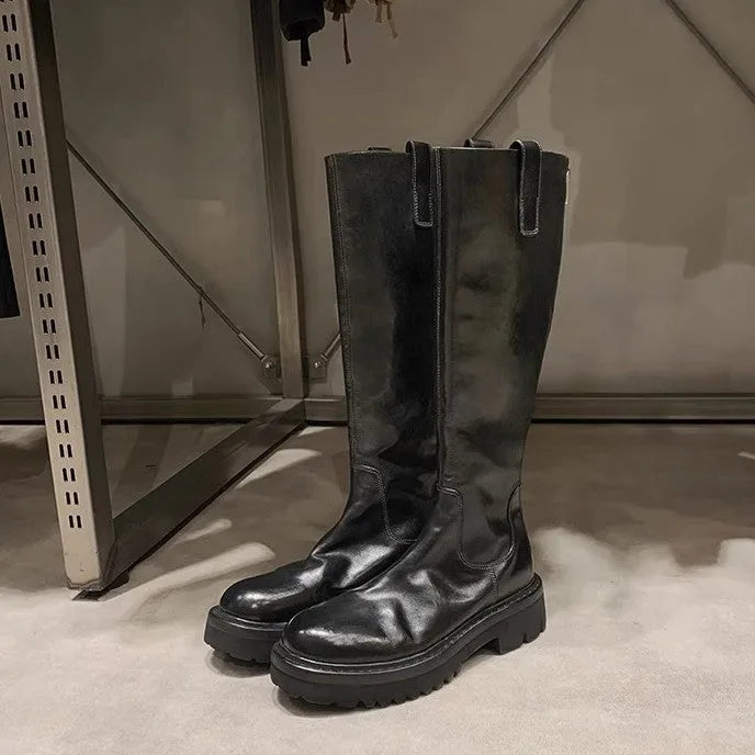 Black and brown women's long tube knight boots with chunky heel and back zipper.