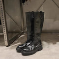 Black and brown women's long tube knight boots with chunky heel and back zipper.