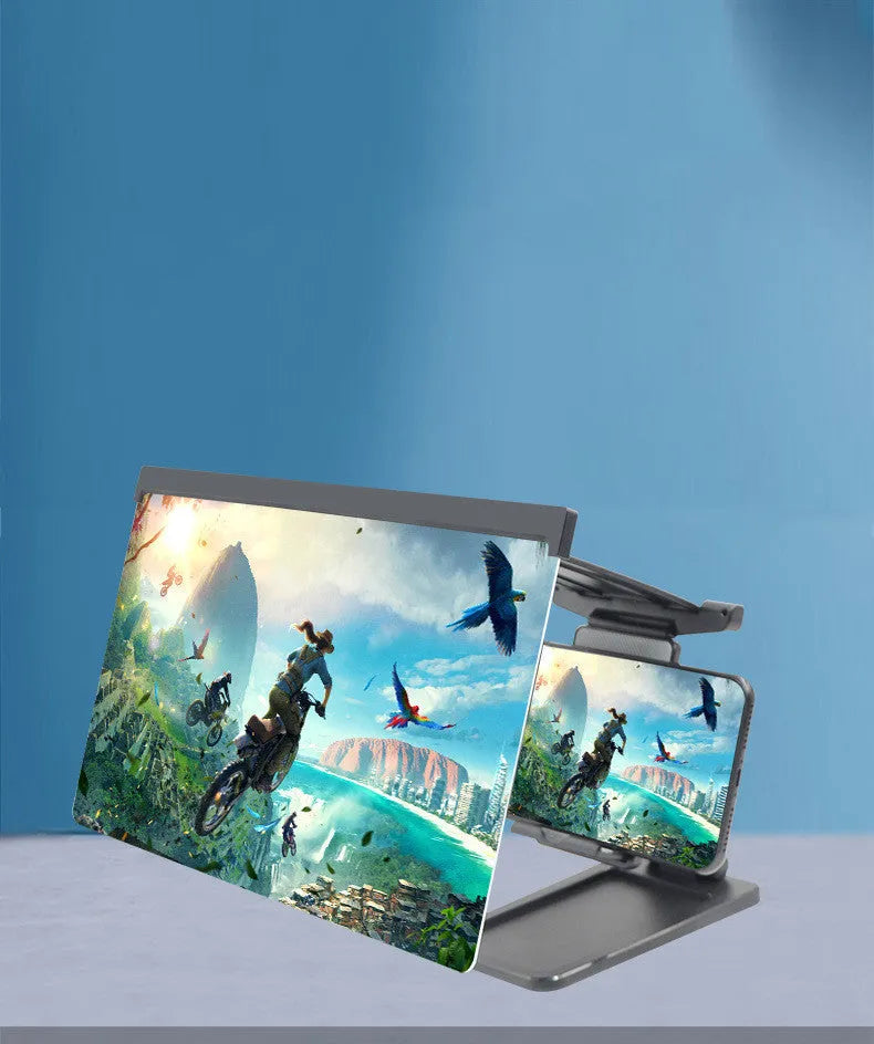 Black folding mobile phone screen amplifier with detachable holder on a desktop.