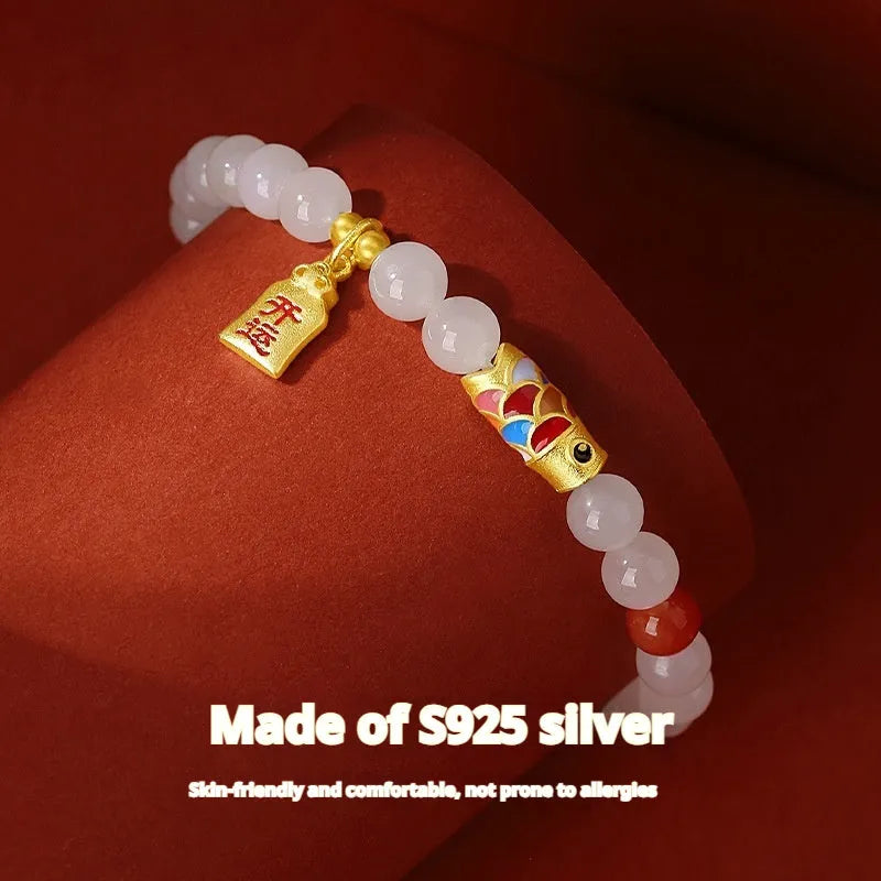 S925 sterling silver bracelet with a 6mm Hetian jade bead and a detailed cold enamel koi fish charm.