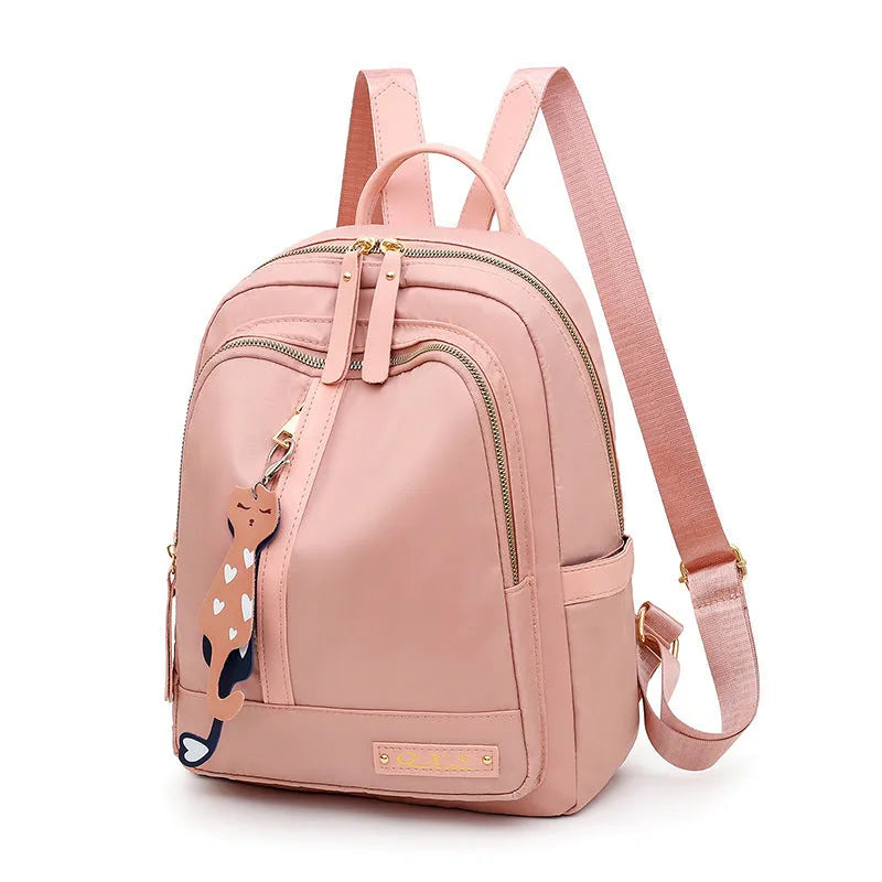 Black and pink views of a women's casual nylon backpack with double straps, a soft handle, and an external pocket.